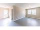 Neutral living room featuring bright light from the window, door to the outside at 3884 Rockey Valley Dr, Conley, GA 30288