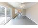 Open-concept living room flows into the kitchen with sliding doors to the backyard at 3884 Rockey Valley Dr, Conley, GA 30288