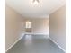 Neutral living room featuring open doorway to another room and neutral paint at 3884 Rockey Valley Dr, Conley, GA 30288