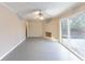 Spacious living room with a fireplace and sliding glass doors to the backyard at 3884 Rockey Valley Dr, Conley, GA 30288