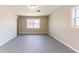 Neutral living room featuring bright windows and neutral paint at 3884 Rockey Valley Dr, Conley, GA 30288
