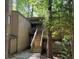 Exterior view of the property with stairs and natural landscaping at 5824 Par Four Ct # 5824, Lithonia, GA 30038