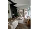 Bright living room with modern fireplace, hardwood floors, and built in bookshelves at 5824 Par Four Ct # 5824, Lithonia, GA 30038
