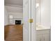 Half bathroom featuring a white sink and an open doorway to the living room at 11853 Harbour Town Pkwy, Fayetteville, GA 30215