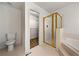 A full bathroom featuring a shower, a bathtub, and an open walk-in closet at 11853 Harbour Town Pkwy, Fayetteville, GA 30215