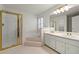Bathroom featuring dual sinks, a shower, and a bathtub at 11853 Harbour Town Pkwy, Fayetteville, GA 30215