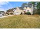 Two-story home featuring a two-car garage, a red front door, and a well-manicured lawn at 11853 Harbour Town Pkwy, Fayetteville, GA 30215