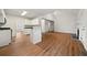 Open concept kitchen featuring white cabinets, green countertops, and stainless steel appliances at 11853 Harbour Town Pkwy, Fayetteville, GA 30215