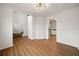 Spacious living room featuring hardwood floors, white walls, and a chandelier at 11853 Harbour Town Pkwy, Fayetteville, GA 30215