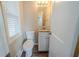 Well-lit bathroom with granite countertop vanity and wood-look flooring at 1433 Dennis Dr, Decatur, GA 30032