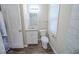 This bathroom has a window for natural light, a tub with a shower and updated vanity at 1433 Dennis Dr, Decatur, GA 30032