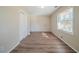 Bedroom featuring ample natural light, closet, and wood-look floors at 1433 Dennis Dr, Decatur, GA 30032