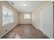 Bedroom with natural light, closet, and wood-look flooring at 1433 Dennis Dr, Decatur, GA 30032
