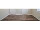Bedroom featuring wood-look flooring and two doors at 1433 Dennis Dr, Decatur, GA 30032