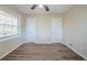 Bedroom featuring wood floors, neutral walls, a ceiling fan, and natural lighting from the window at 1433 Dennis Dr, Decatur, GA 30032