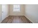 Bedroom featuring a window and wood-look flooring at 1433 Dennis Dr, Decatur, GA 30032