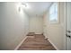 Functional laundry room with wood-look flooring and access door at 1433 Dennis Dr, Decatur, GA 30032