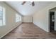 Bright and airy living room with hardwood floors, large windows, and a ceiling fan at 1433 Dennis Dr, Decatur, GA 30032