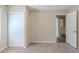 Bedroom with a closet, carpeted floors, and an interior door at 1925 Campbellton Sw Rd, Atlanta, GA 30311