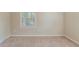 Bright bedroom with neutral paint and natural light from the window at 1925 Campbellton Sw Rd, Atlanta, GA 30311