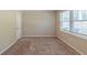 Bedroom with an interior door, closet, and a window at 1925 Campbellton Sw Rd, Atlanta, GA 30311