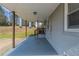 Spacious carport area with concrete flooring and view of the yard at 1925 Campbellton Sw Rd, Atlanta, GA 30311