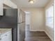 Galley kitchen with stainless steel refrigerator and granite countertops at 1925 Campbellton Sw Rd, Atlanta, GA 30311