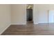 Open-concept living room showcasing hardwood floors and access to the kitchen at 1925 Campbellton Sw Rd, Atlanta, GA 30311