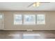 Bright living room with hardwood floors, large windows offering natural light at 1925 Campbellton Sw Rd, Atlanta, GA 30311