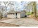 View of the back exterior with a patio and driveway at 3192 Belfort Se Rd, Atlanta, GA 30354