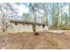 View of the back exterior and the yard at 3192 Belfort Se Rd, Atlanta, GA 30354