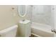 Bathroom features a tub, decorative wall mirror and sink with brushed fixtures at 3192 Belfort Se Rd, Atlanta, GA 30354