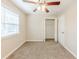 A bedroom with carpet and a window with mini blinds allows natural light at 3192 Belfort Se Rd, Atlanta, GA 30354