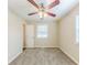 Carpeted bedroom with ceiling fan, window with mini-blinds, and neutral paint at 3192 Belfort Se Rd, Atlanta, GA 30354