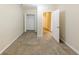 Neutral bedroom with carpet, walk-in closet, and door to hallway for easy access at 3192 Belfort Se Rd, Atlanta, GA 30354