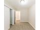 A carpeted bedroom with closet and open door allows easy access to other rooms at 3192 Belfort Se Rd, Atlanta, GA 30354