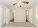 Carpeted bedroom features a ceiling fan, closet and window with blinds at 3192 Belfort Se Rd, Atlanta, GA 30354