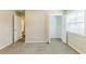 A bedroom with carpet features a closet and window for natural light at 3192 Belfort Se Rd, Atlanta, GA 30354