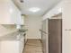 Updated kitchen featuring white cabinets, granite countertops, and stainless steel appliances at 3192 Belfort Se Rd, Atlanta, GA 30354