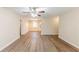 Spacious living room with laminate floors and an open view of the kitchen and dining area at 3192 Belfort Se Rd, Atlanta, GA 30354