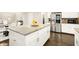 Bright and airy kitchen with granite counters, stainless steel appliances, and a large center island at 3680 Falling Leaf Ln, Cumming, GA 30041