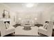 Cozy living room with coffered ceilings, fireplace and neutral decor creates an inviting atmosphere at 3680 Falling Leaf Ln, Cumming, GA 30041