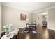 Cozy office space featuring hardwood floors, ample natural light, and a view of the dining room at 3680 Falling Leaf Ln, Cumming, GA 30041