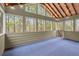 Enclosed porch with many windows offers natural light and a relaxing atmosphere at 3680 Falling Leaf Ln, Cumming, GA 30041