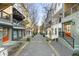 Townhome backyard view showing colorful facades with central walkway, offering a private outdoor space at 754 Aerial Way, Atlanta, GA 30312