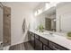 Modern bathroom featuring double vanity, framed mirror, and tiled shower at 754 Aerial Way, Atlanta, GA 30312