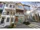 Eye-level view of townhomes showcasing a variety of exterior colors and styles at 754 Aerial Way, Atlanta, GA 30312