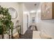 Entryway with console table, a neutral rug, art, and wood-look flooring at 754 Aerial Way, Atlanta, GA 30312