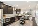 Modern kitchen with dark wood cabinets, stainless steel appliances, and kitchen island at 754 Aerial Way, Atlanta, GA 30312