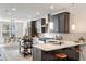 Stylish kitchen with stainless appliances, a breakfast bar, and pendant lighting offers modern amenities at 754 Aerial Way, Atlanta, GA 30312